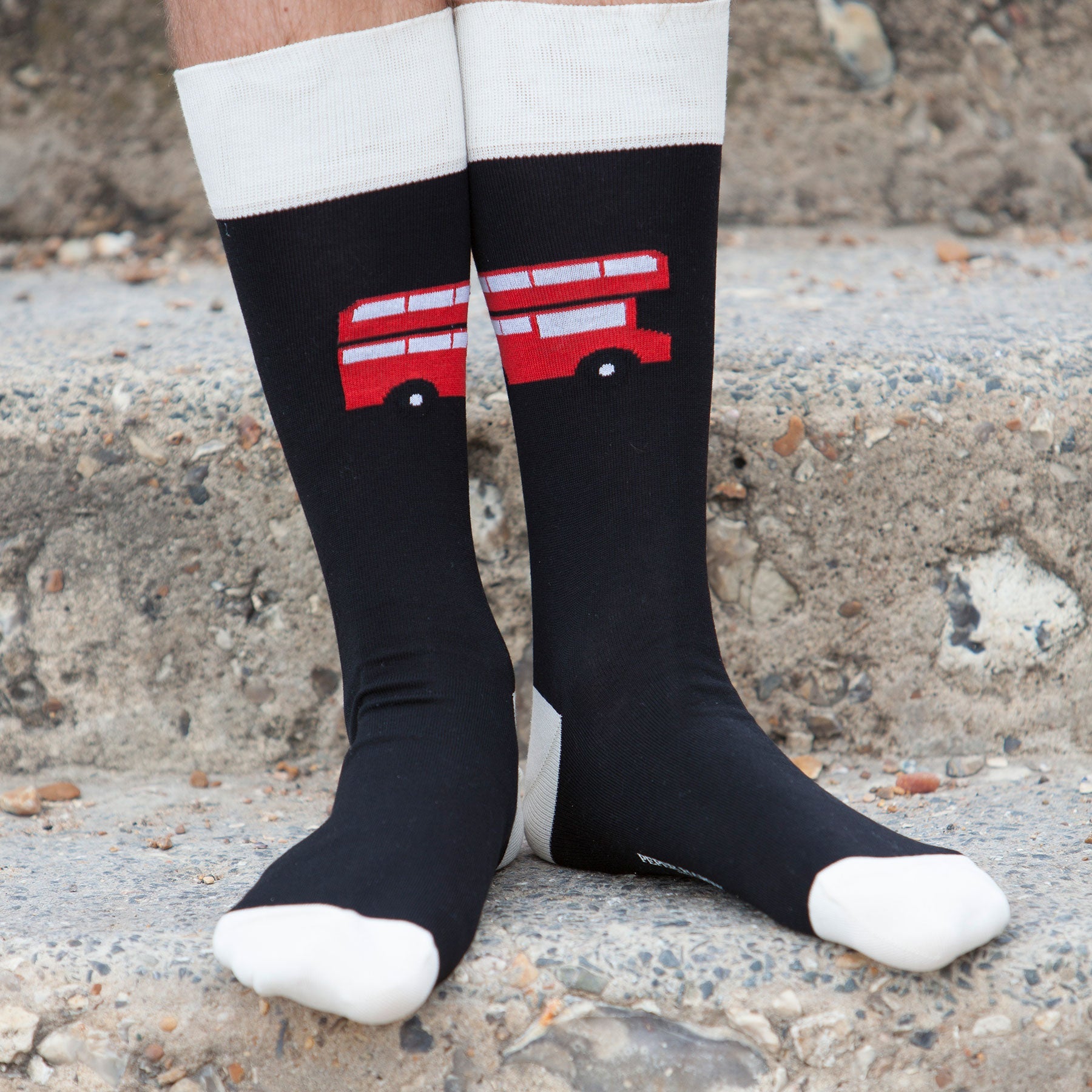 Luxury black men's socks featuring an iconic London red bus design, crafted from Mercerised Egyptian cotton.