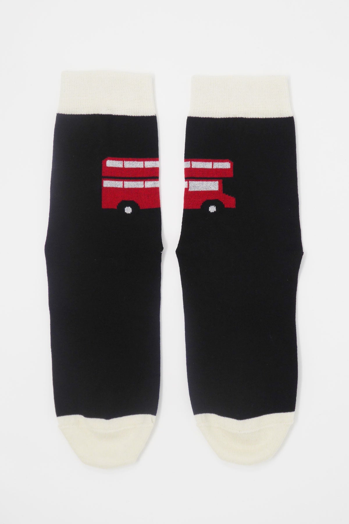 A pair of luxurious black women's socks featuring an iconic red London bus design, showcasing quality craftsmanship.