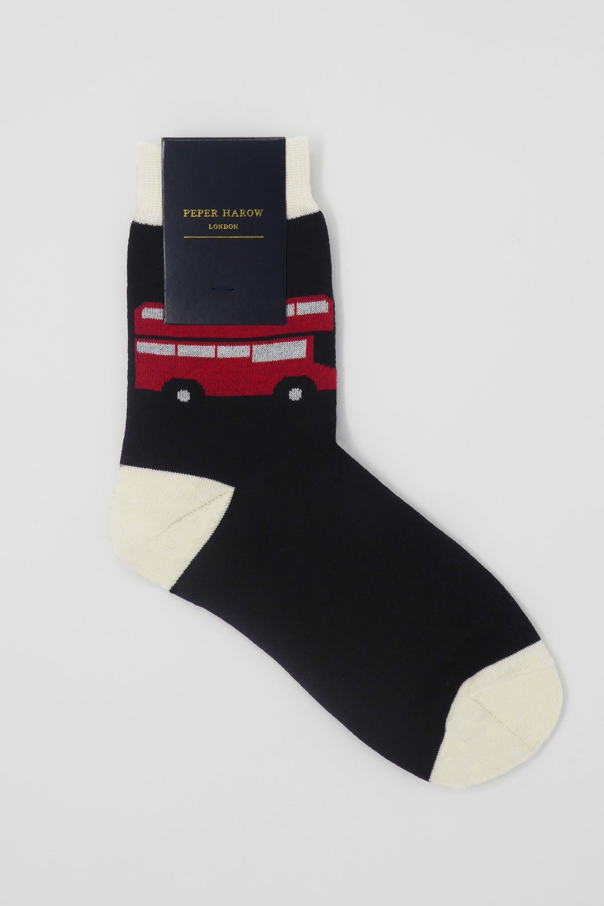 A pair of luxurious black women's socks featuring an iconic red London bus design, showcasing quality craftsmanship.