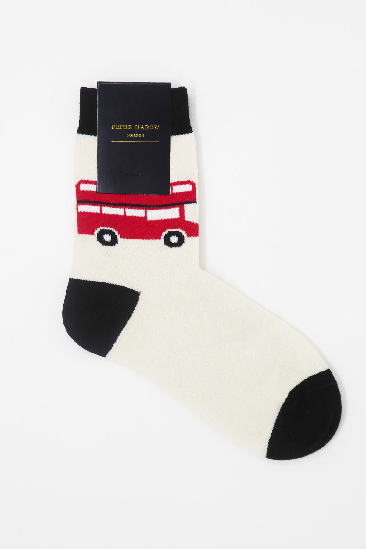 Cream women's socks featuring an iconic London red bus design, showcasing luxury and comfort.