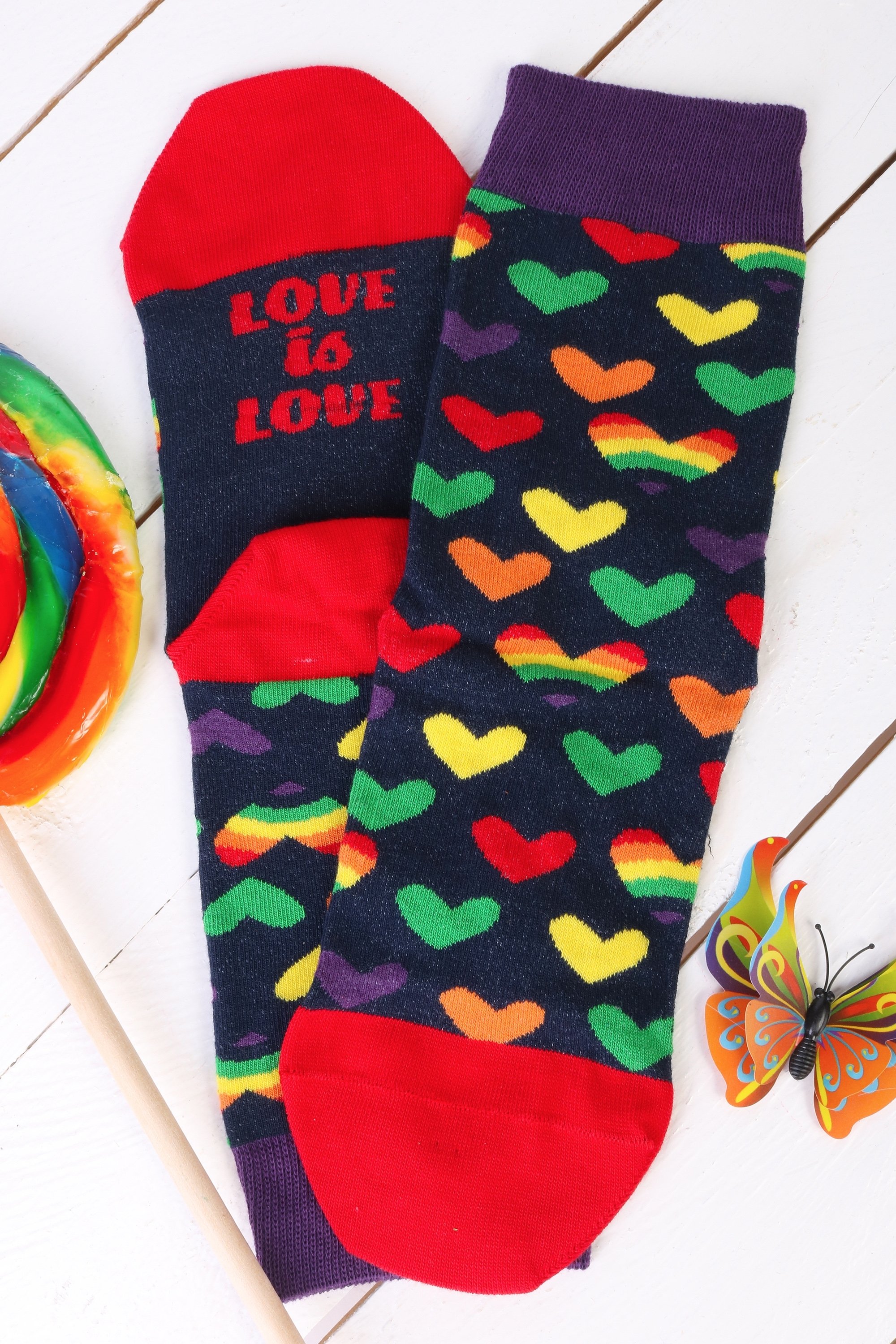 Colorful LOVE cotton socks featuring rainbow hearts and 'Love is Love' message under the soles, suitable for men and women.