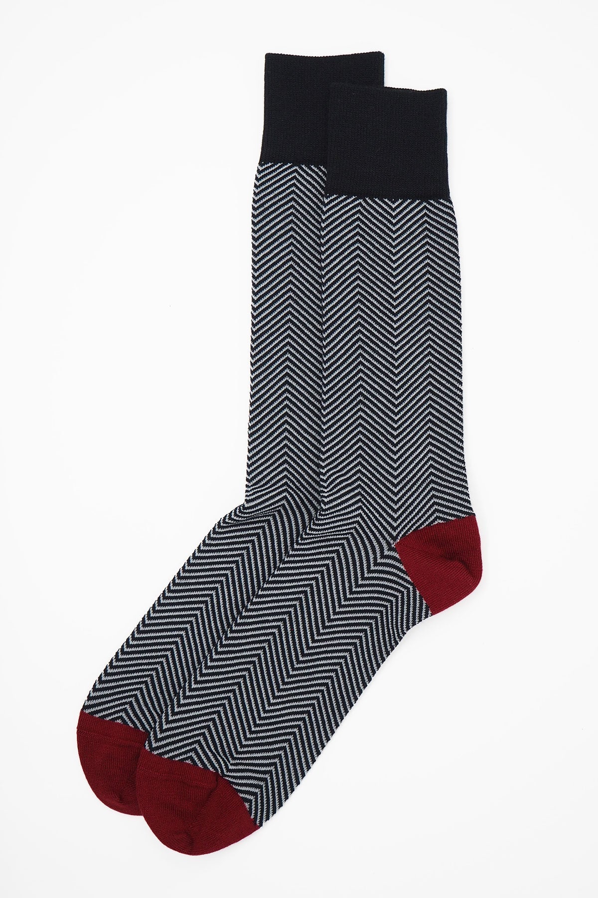 Lux Taylor Men's Socks in black with white zigzag pattern and red heel and toe, showcasing luxury and style.