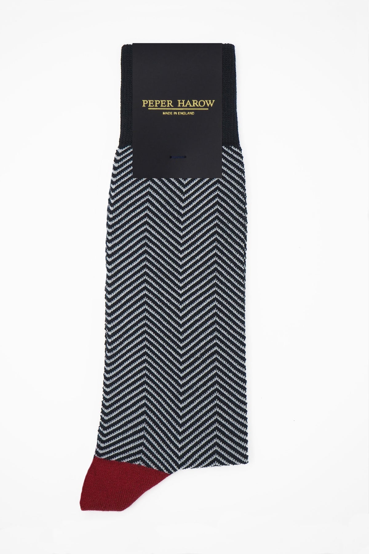 Lux Taylor Men's Socks in black with white zigzag pattern and red heel and toe, showcasing luxury and style.