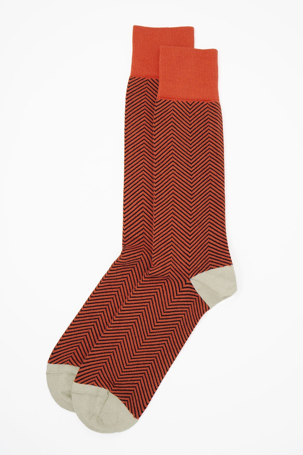 Lux Taylor Men's Socks in vibrant orange with black zigzag pattern and cream heel and toe, showcasing luxury and style.