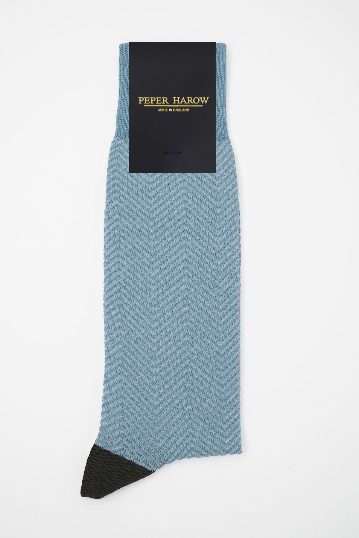 Lux Taylor Men's Socks in sky blue with white zigzag pattern and black heel and toe, showcasing luxury and style.