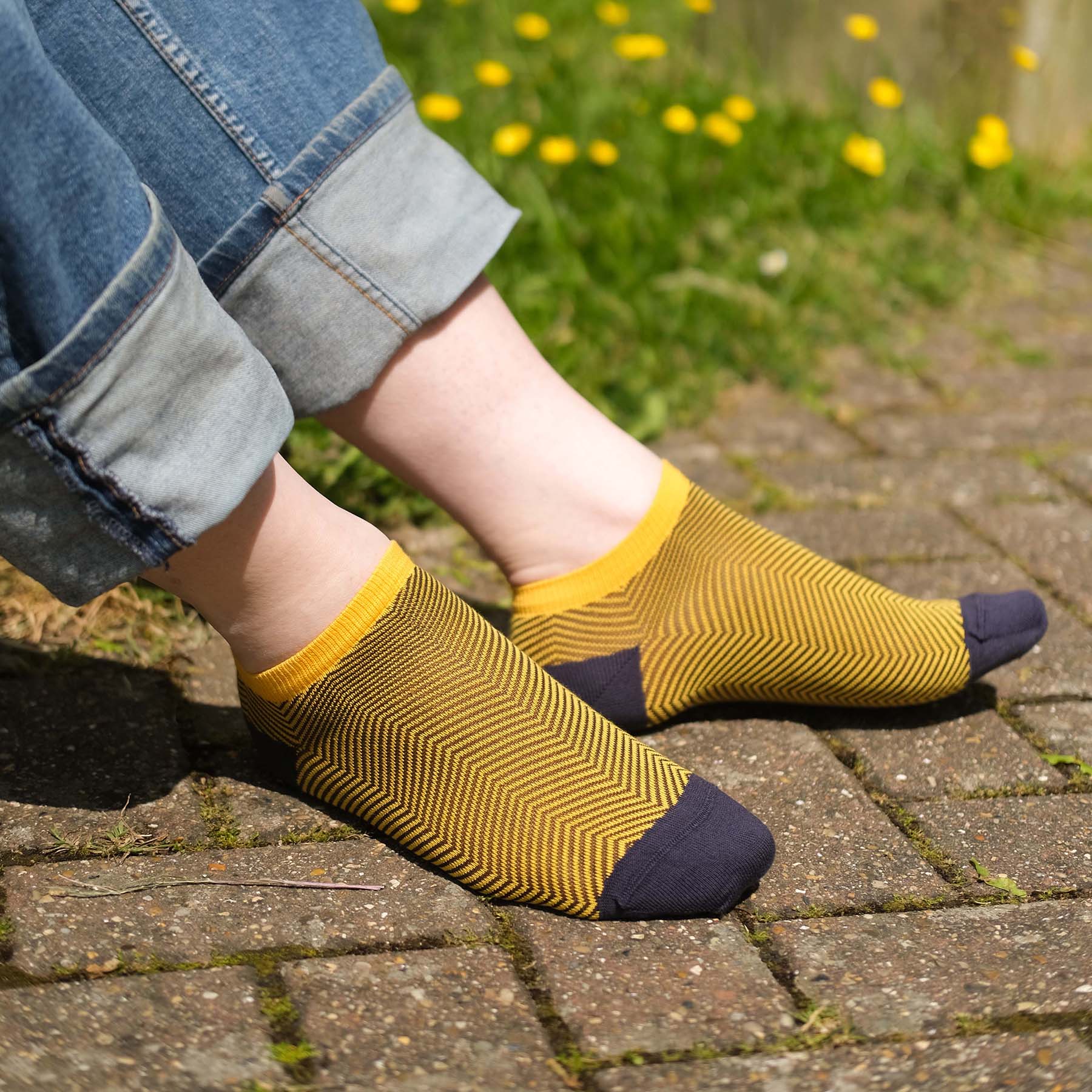 Lux Taylor Men's Trainer Socks in yellow with black zigzag pattern and navy heel and toe, showcasing luxury and style.