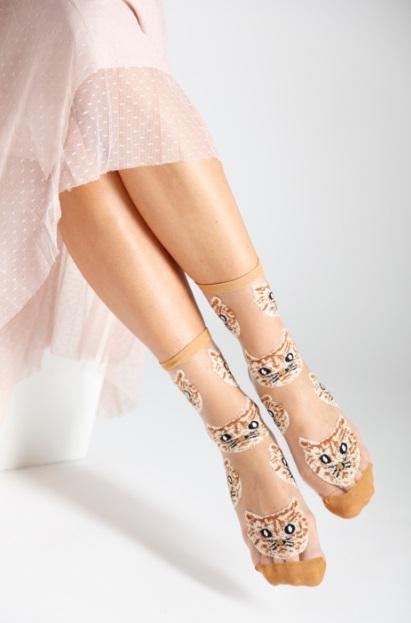 Light brown sheer socks featuring playful cat patterns, perfect for women.