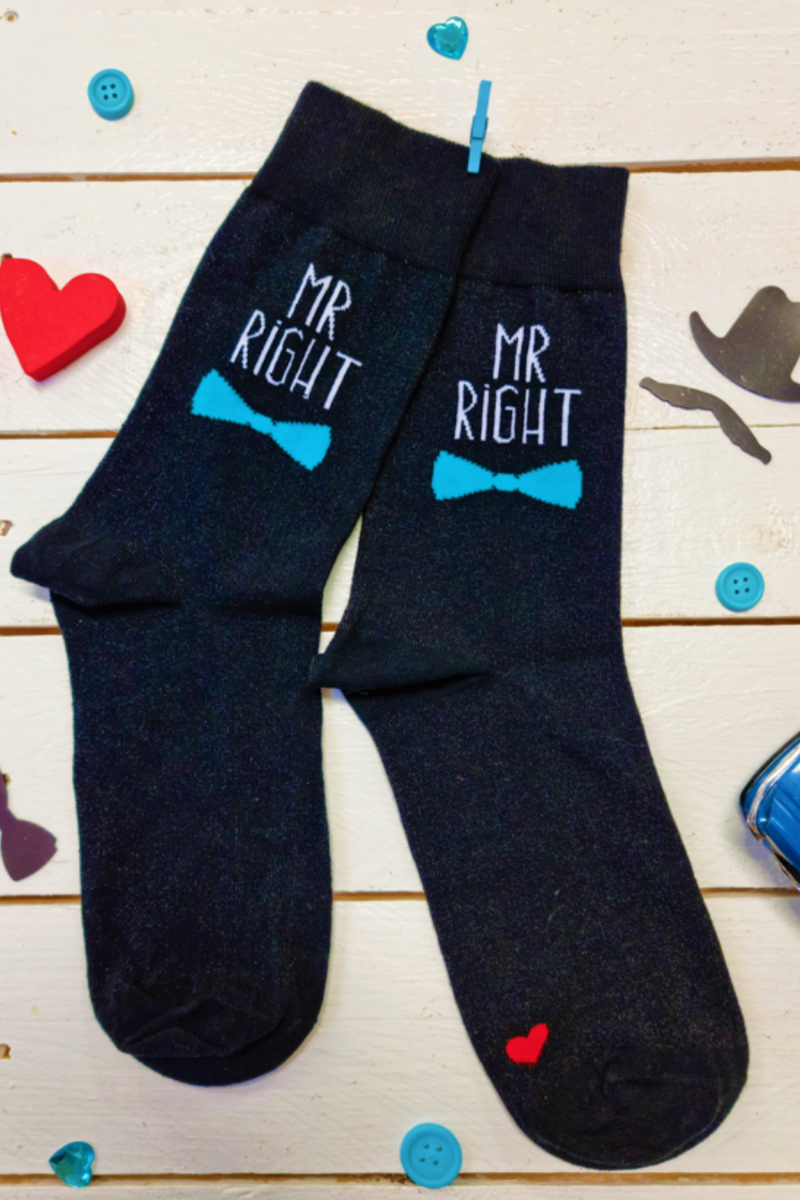 Mr RIGHT antibacterial sock featuring silver thread, black color with blue tie and 'Mr Right' text, and a tiny red heart under the sole.