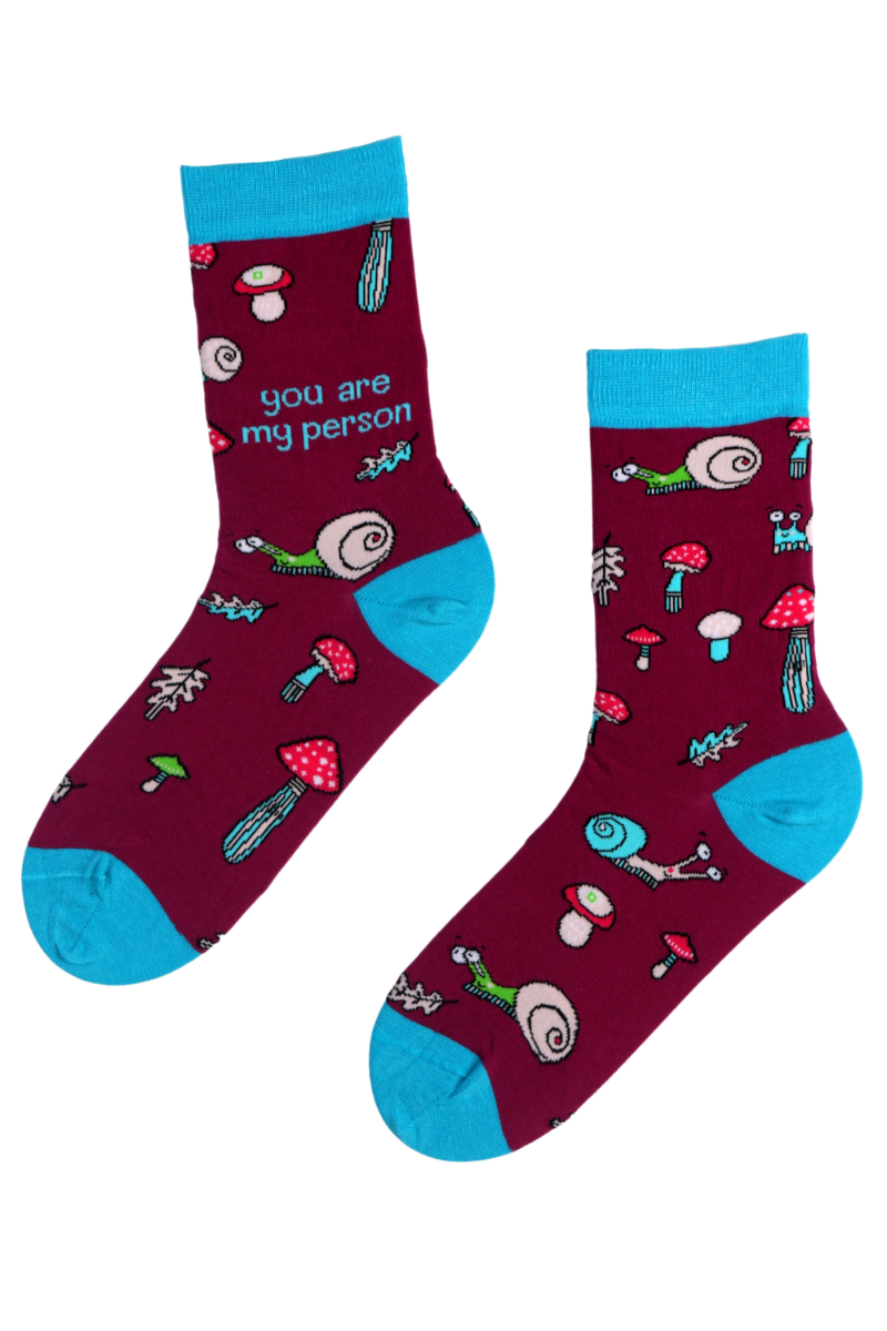 A pair of purple cotton socks with the text 'You Are My Person' printed on both sides, showcasing a cozy and heartfelt design.