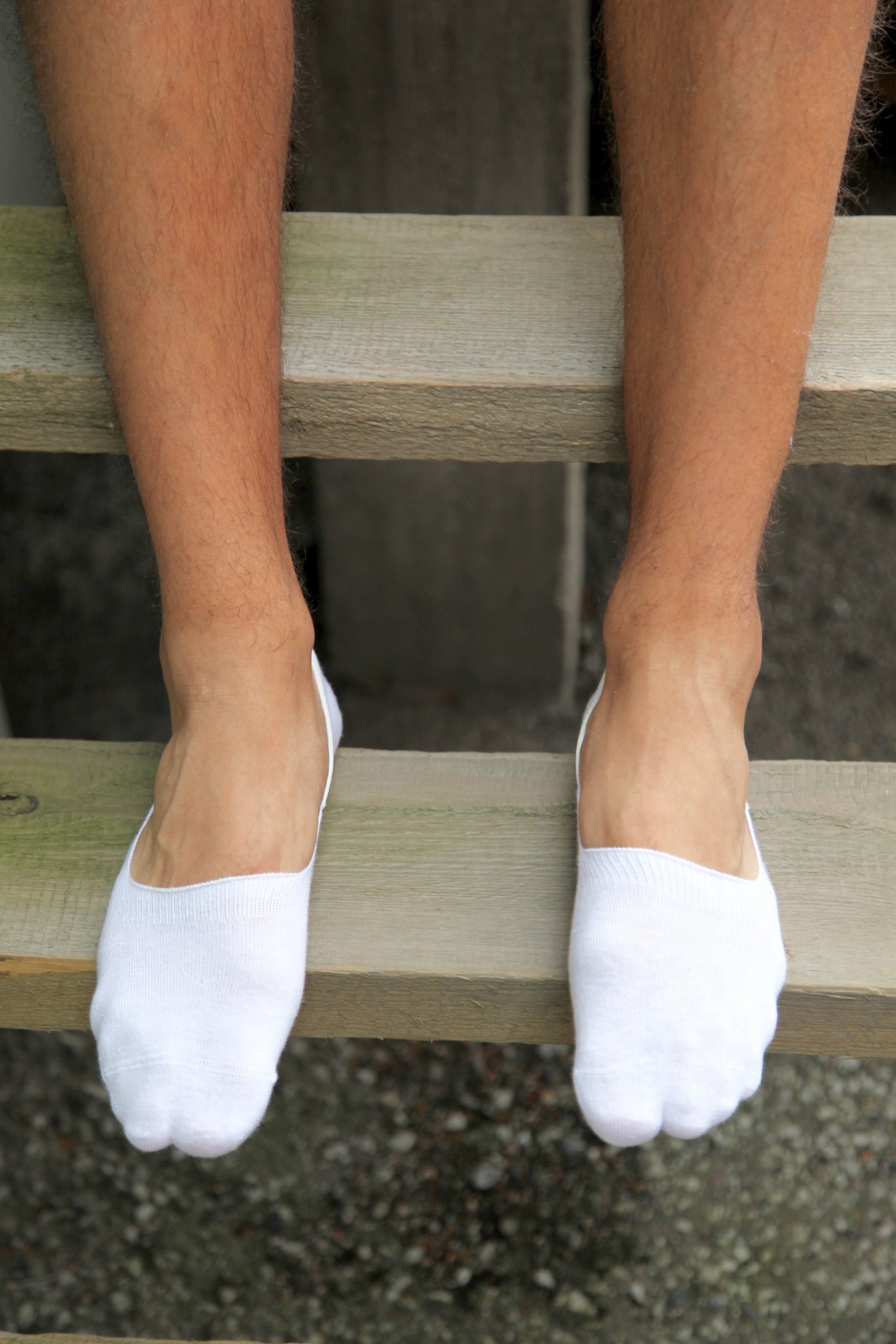 NORMAN men's white low-cut socks featuring silicone heel grips for secure fit and comfort.