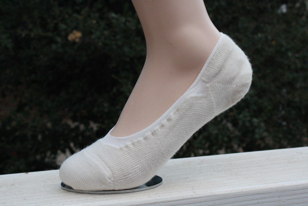 A pair of no-show alpaca socks showcasing their soft texture and hidden design, perfect for comfort and breathability.