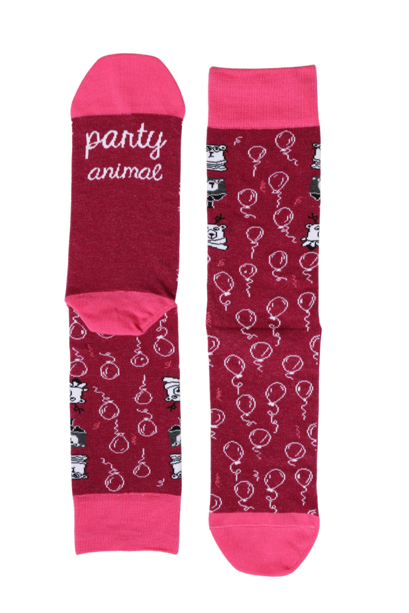 A pair of vibrant dark pink cotton socks with 'PARTYANIMAL' inscription on the sole, perfect for party lovers.