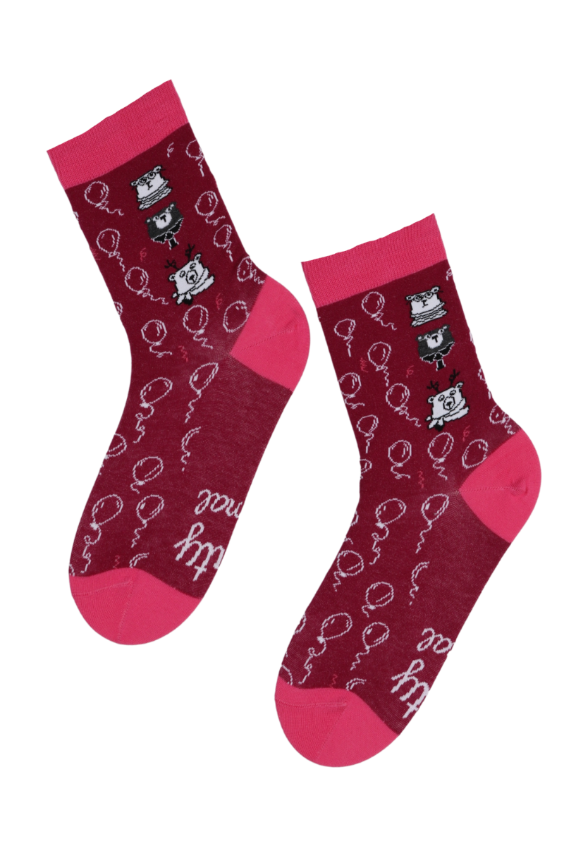 A pair of vibrant dark pink cotton socks with 'PARTYANIMAL' inscription on the sole, perfect for party lovers.