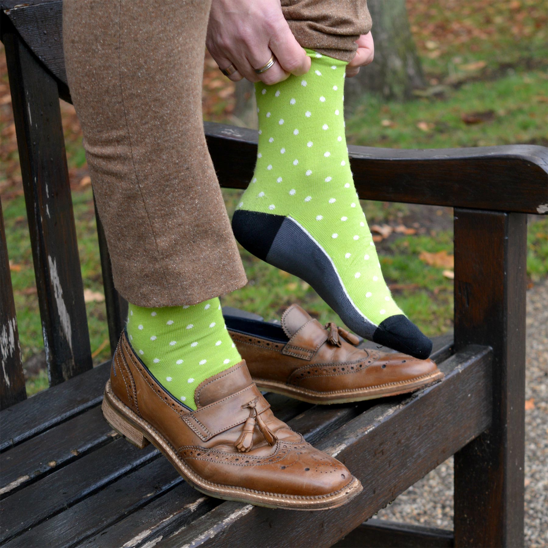 Mint Pin Polka Men's Socks featuring vibrant polka dots and contrasting cuffs, heels, and toes, made from luxurious Supima cotton.