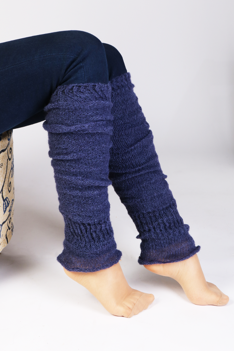 A pair of PREMIA blue leg warmers featuring a light rib design and expanded bottom for a comfortable fit.