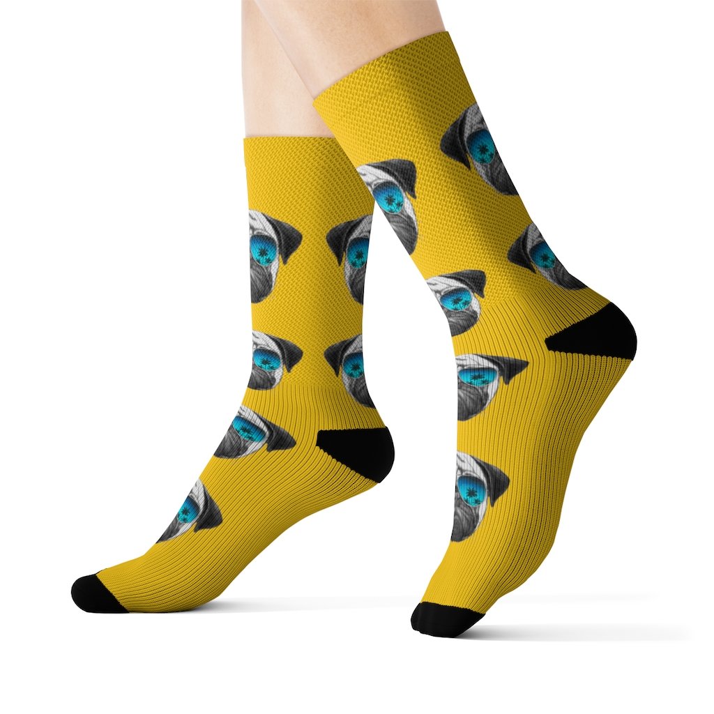 A pair of fun novelty socks featuring a cute Pug wearing sunglasses, showcasing a vibrant and playful design.