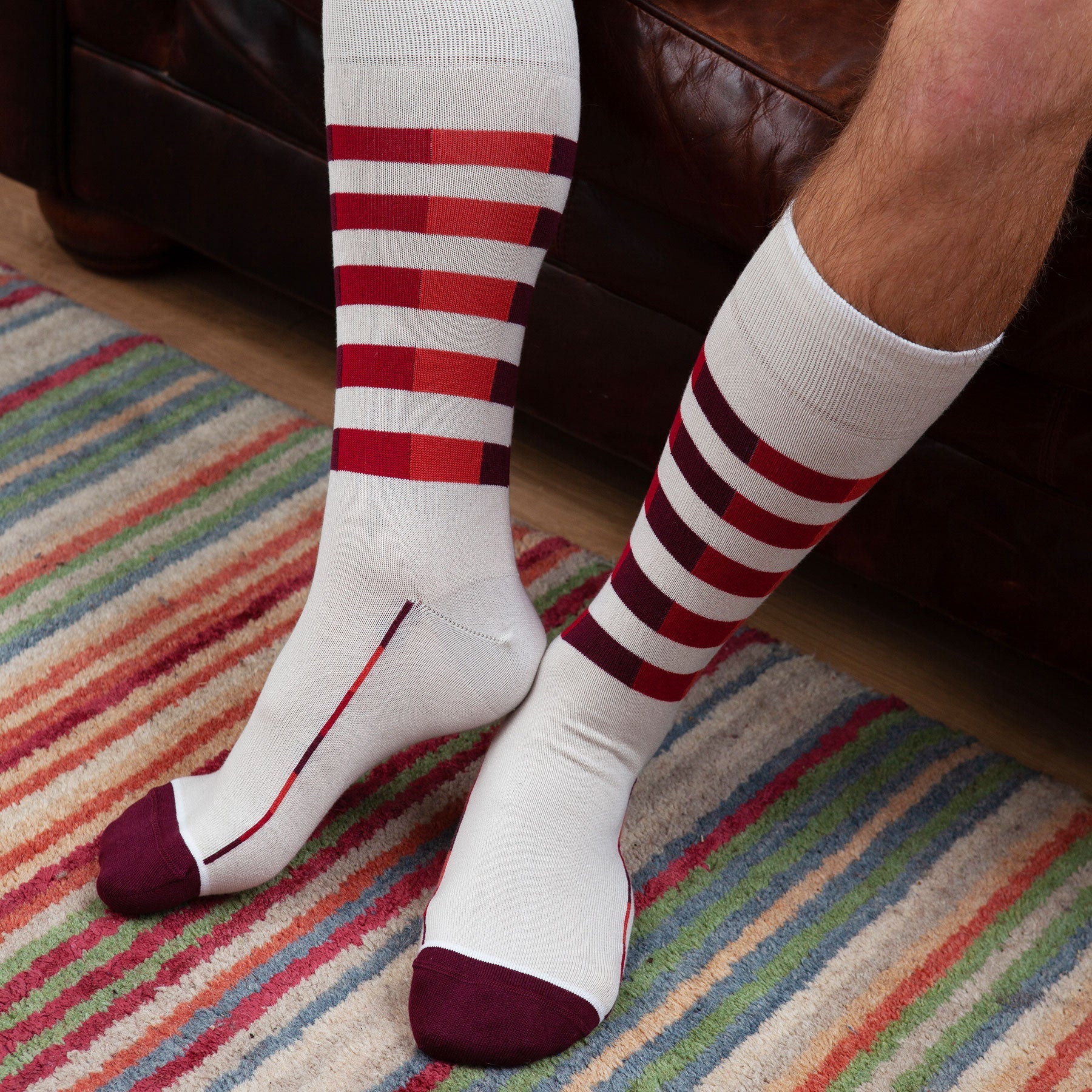 Cream Quad Stripe men's luxury socks featuring vibrant burgundy, red, and peach stripes on a soft cream background.