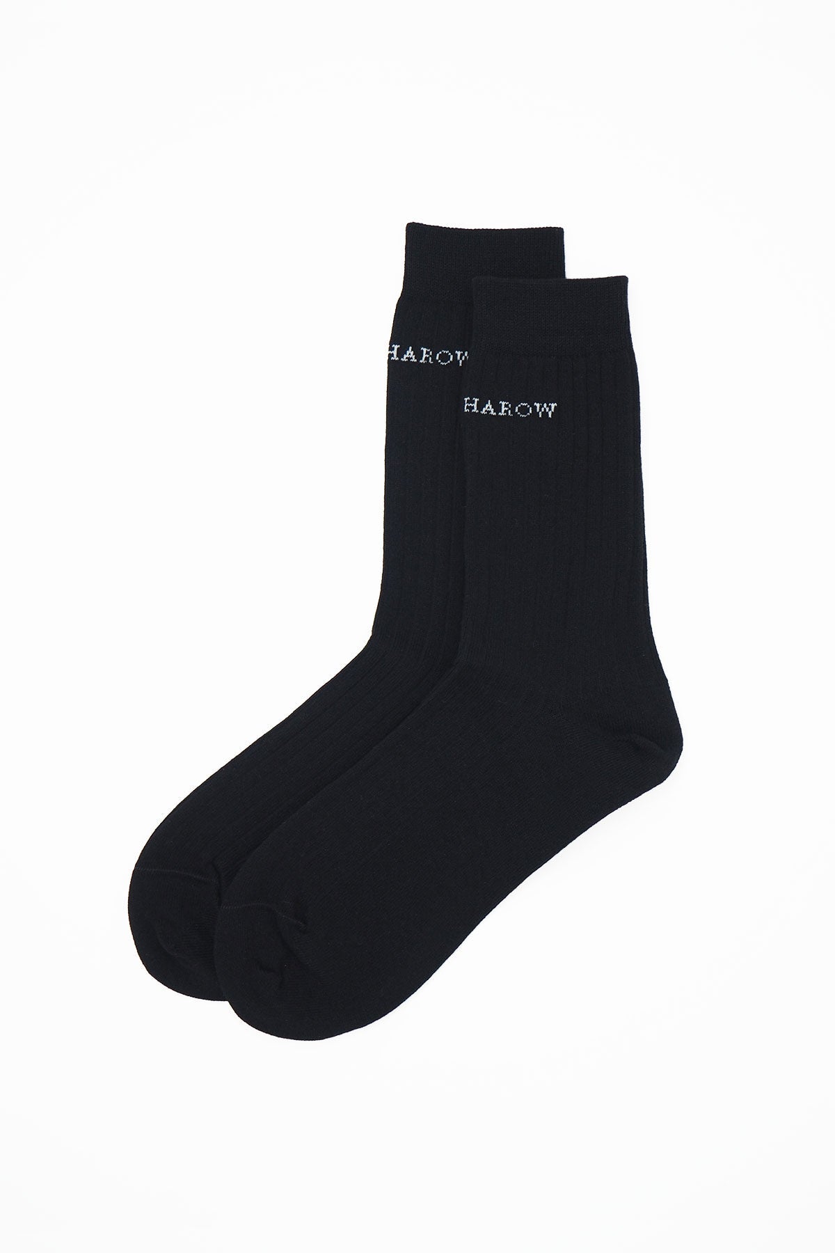 A pair of black ribbed women's socks made from recycled materials, showcasing their eco-friendly design and seamless toe.