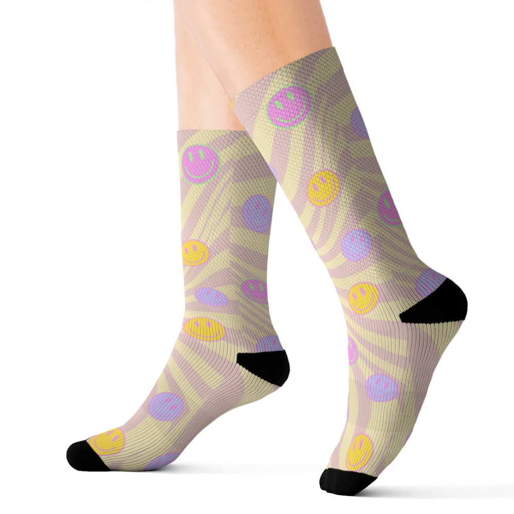 A pair of Retro Happy Face Fun Novelty Socks featuring a vibrant happy face print, designed for comfort and style.