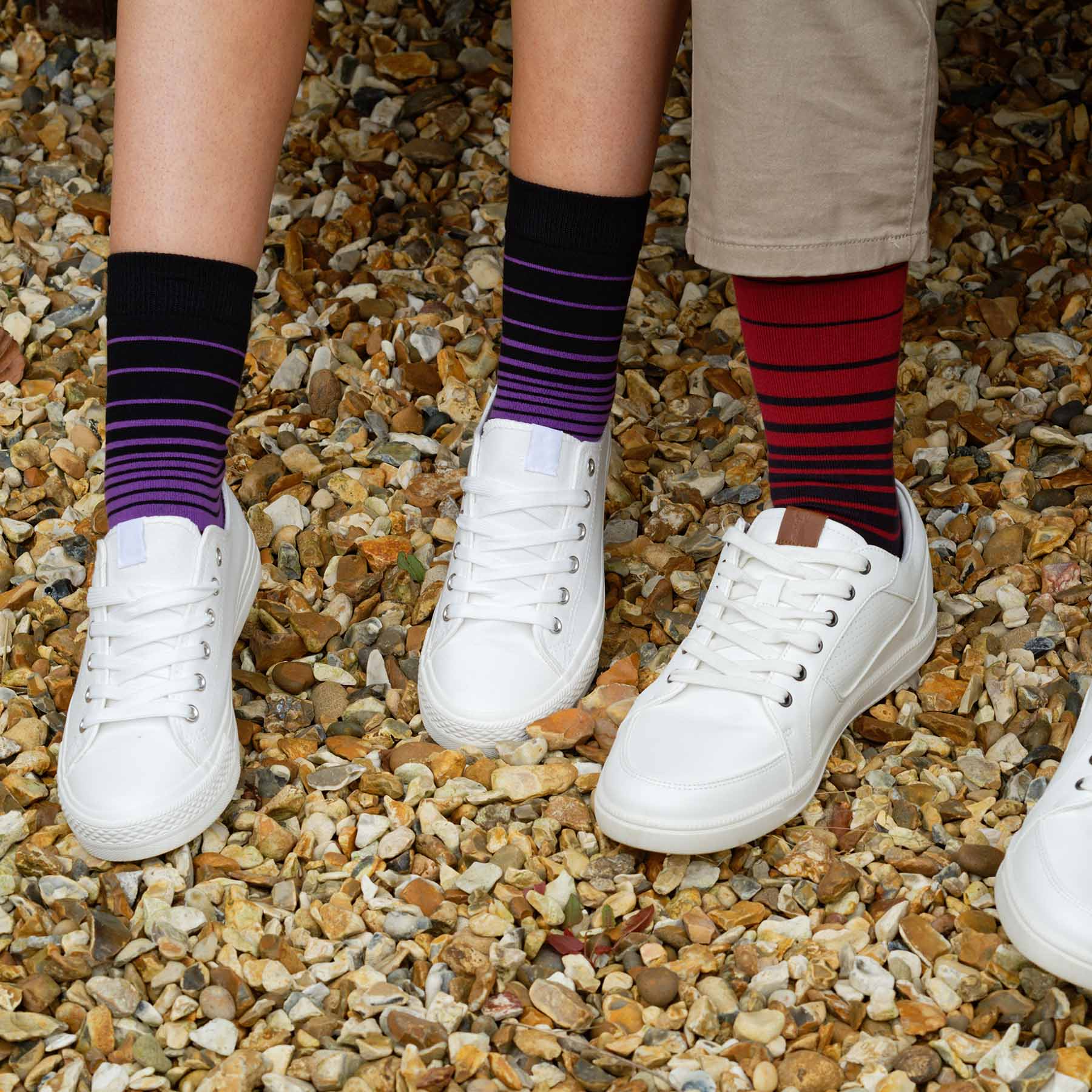 A pair of Retro Stripe Women's Socks in purple with contrasting black stripes, showcasing luxury and style.