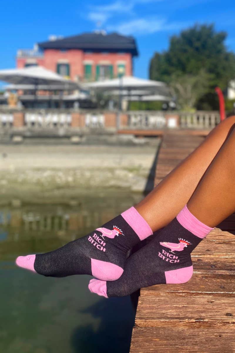 RICH BITCH pink socks for women featuring a cockatoo design and bold lettering, perfect for stylish and confident wearers.