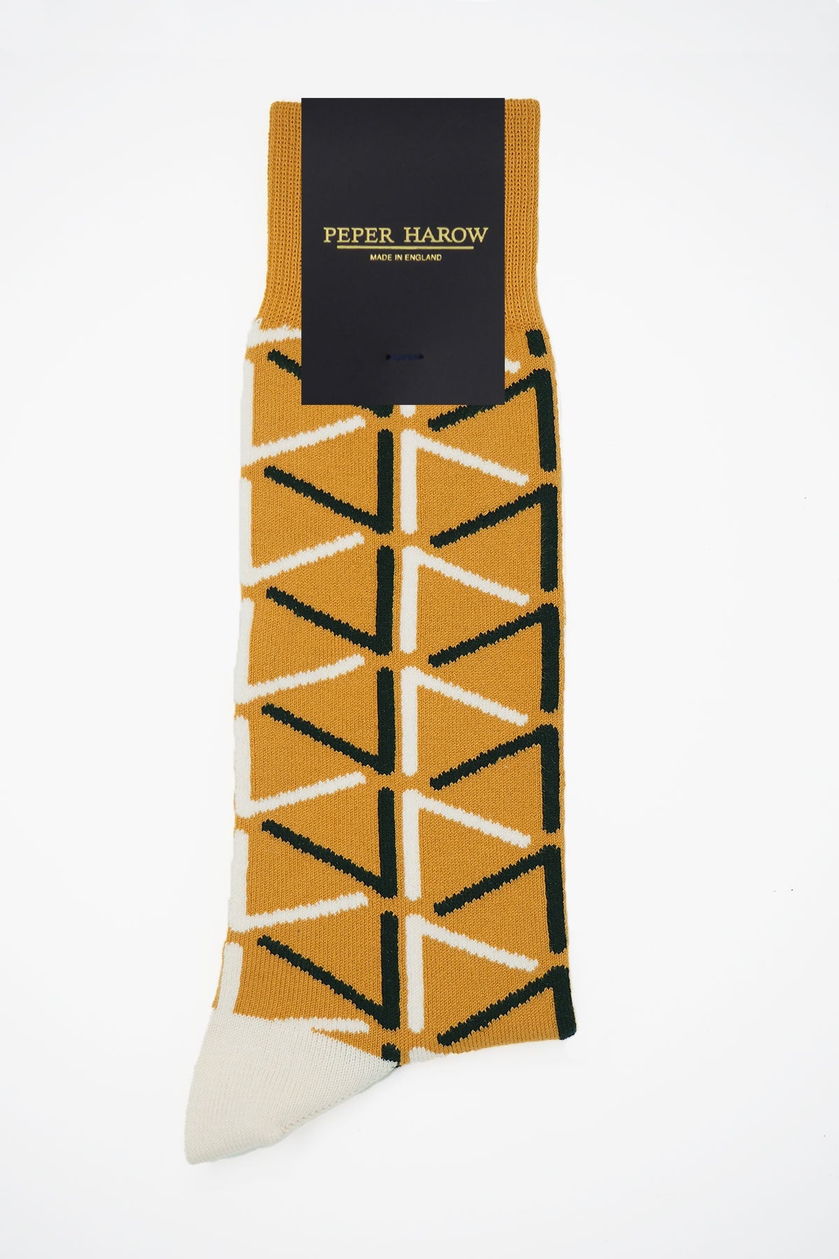 A pair of stylish mustard socks for men featuring contrasting black and cream patterns, made from luxurious Supima cotton.