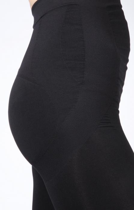 A pair of SHAPE body shaping leggings designed to enhance curves, featuring a sleek black design and a comfortable fit.