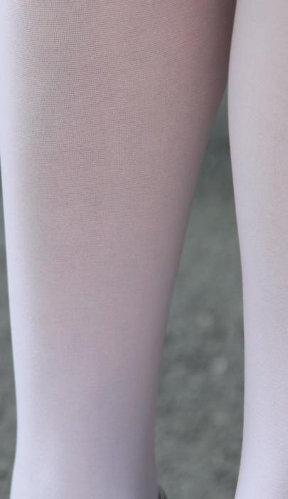 STIINA WHITE tights displayed on a neutral background, showcasing their soft microfiber texture and comfortable design.