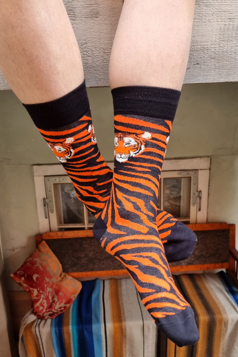 A pair of stylish TIGER cotton socks featuring elegant black and orange stripes, perfect for animal lovers.