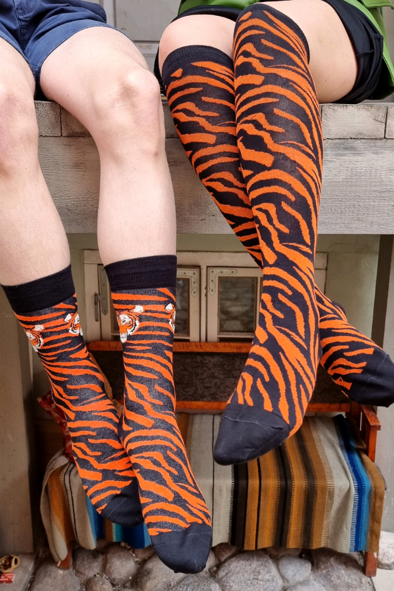 A pair of stylish TIGER cotton socks featuring elegant black and orange stripes, perfect for animal lovers.