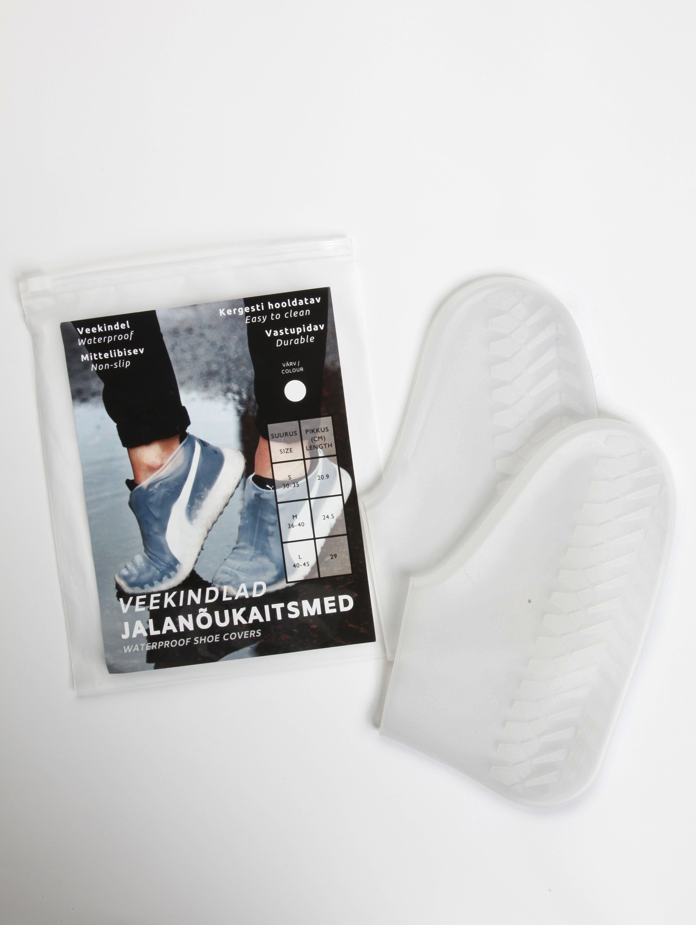 White waterproof shoe covers made of silicone, designed to protect shoes from rain and mud with an anti-slip sole.