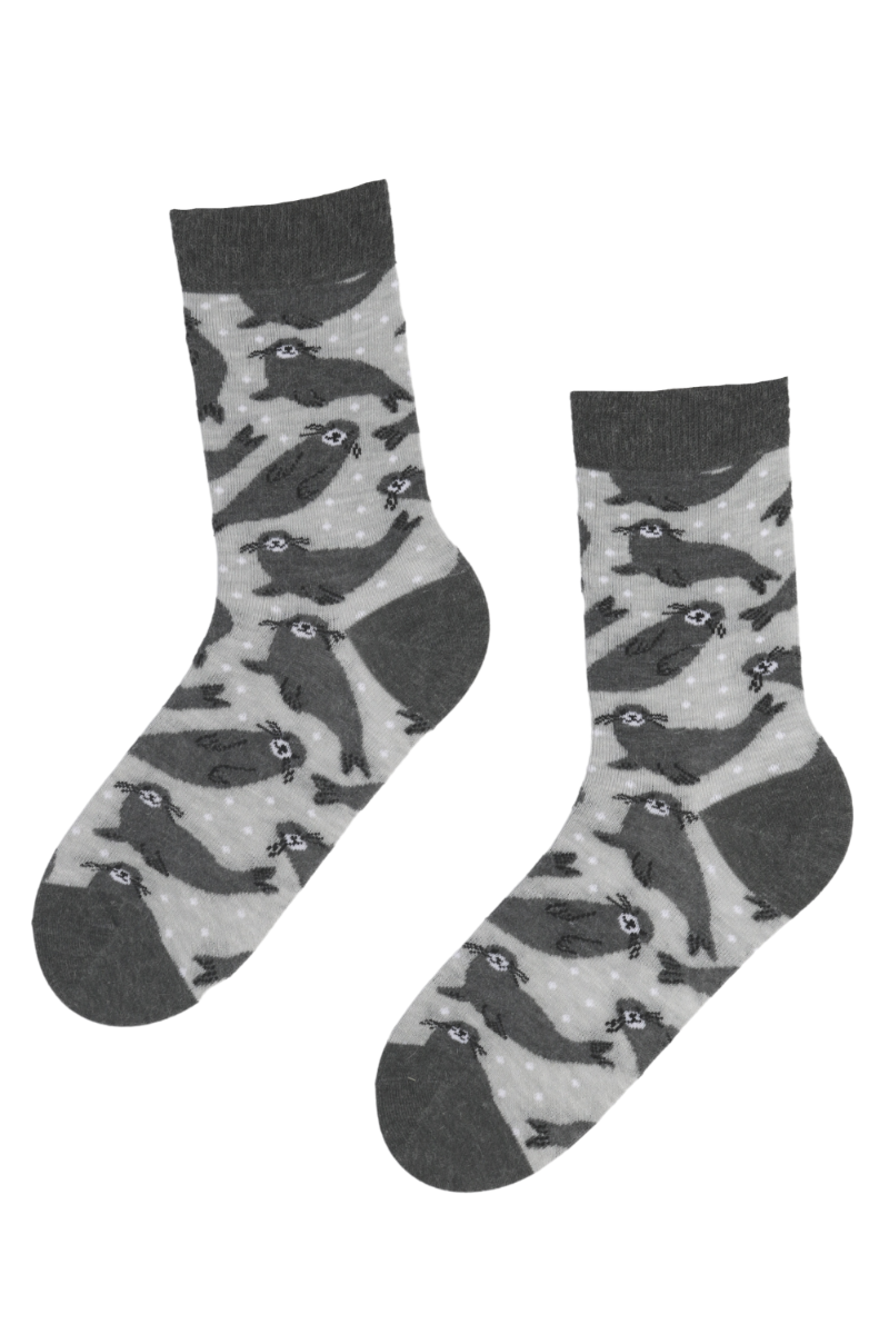 A pair of WINTER SEAL grey angora wool socks featuring playful gray seal designs, perfect for winter warmth and comfort.