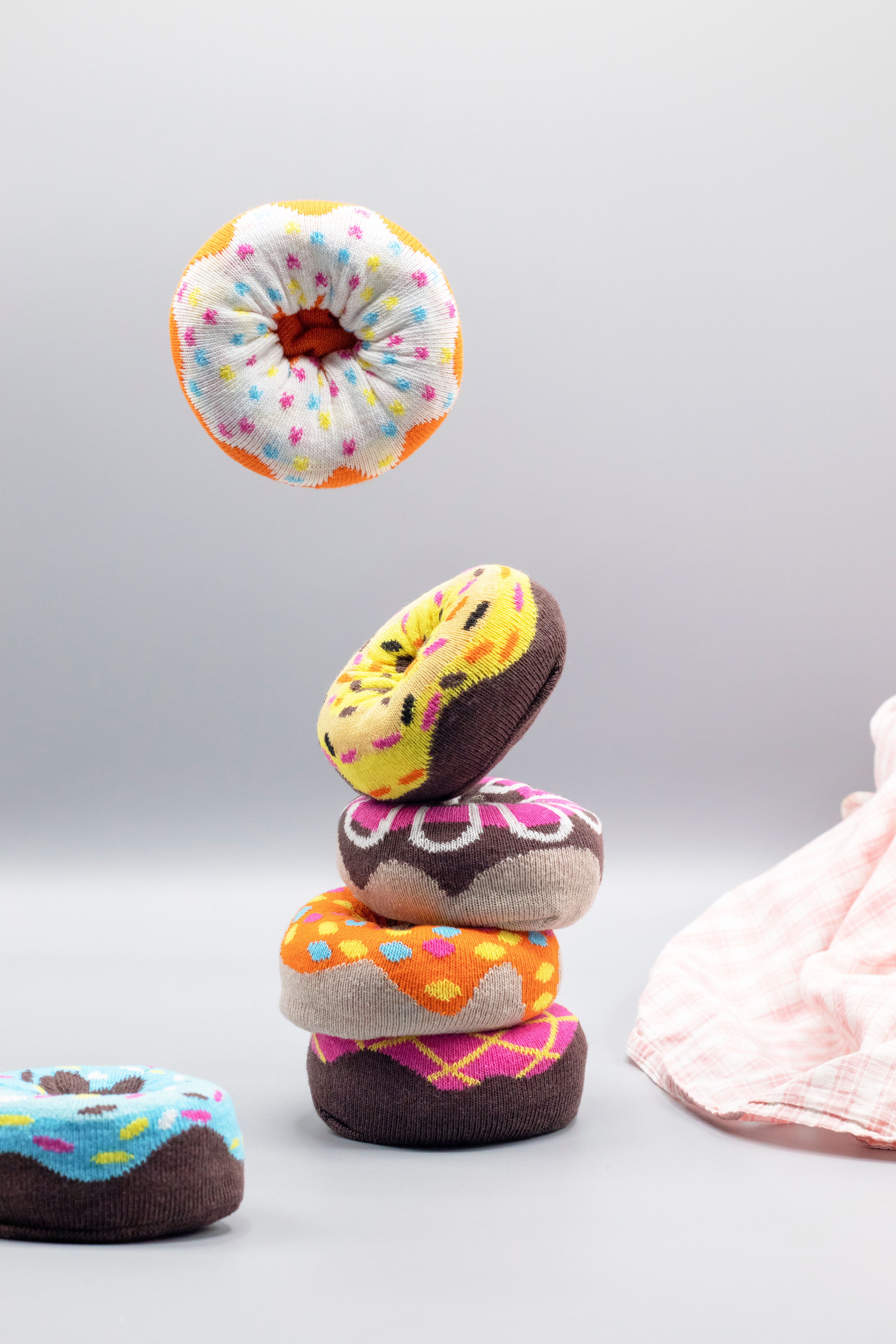 A colorful assortment of six women's donut socks in a gift box, showcasing vibrant patterns and soft cotton material, perfect for everyday wear.