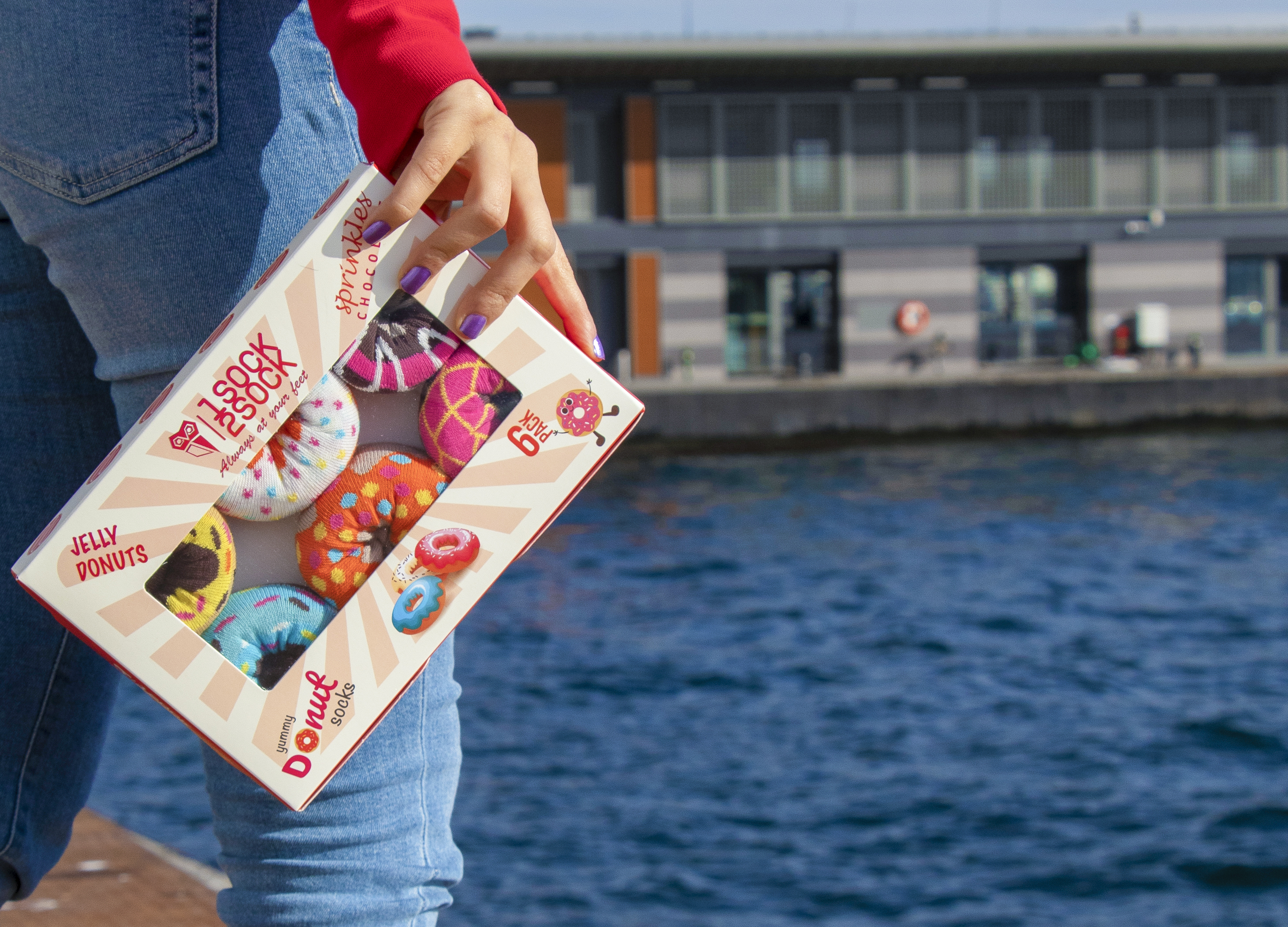 A colorful assortment of six women's donut socks in a gift box, showcasing vibrant patterns and soft cotton material, perfect for everyday wear.