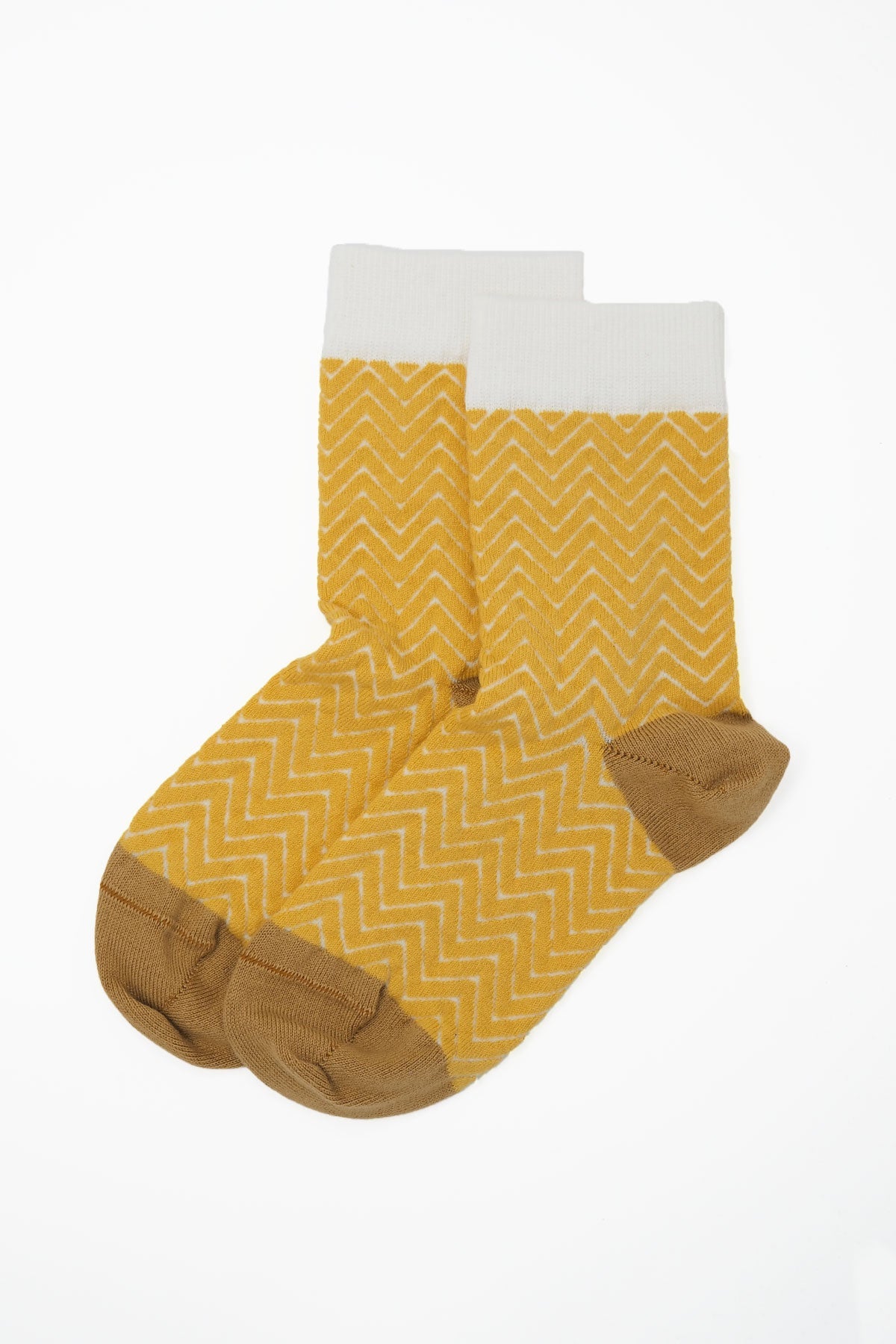 A pair of vibrant yellow and white Zigzag women's socks made from luxurious Supima cotton, showcasing a stylish design.