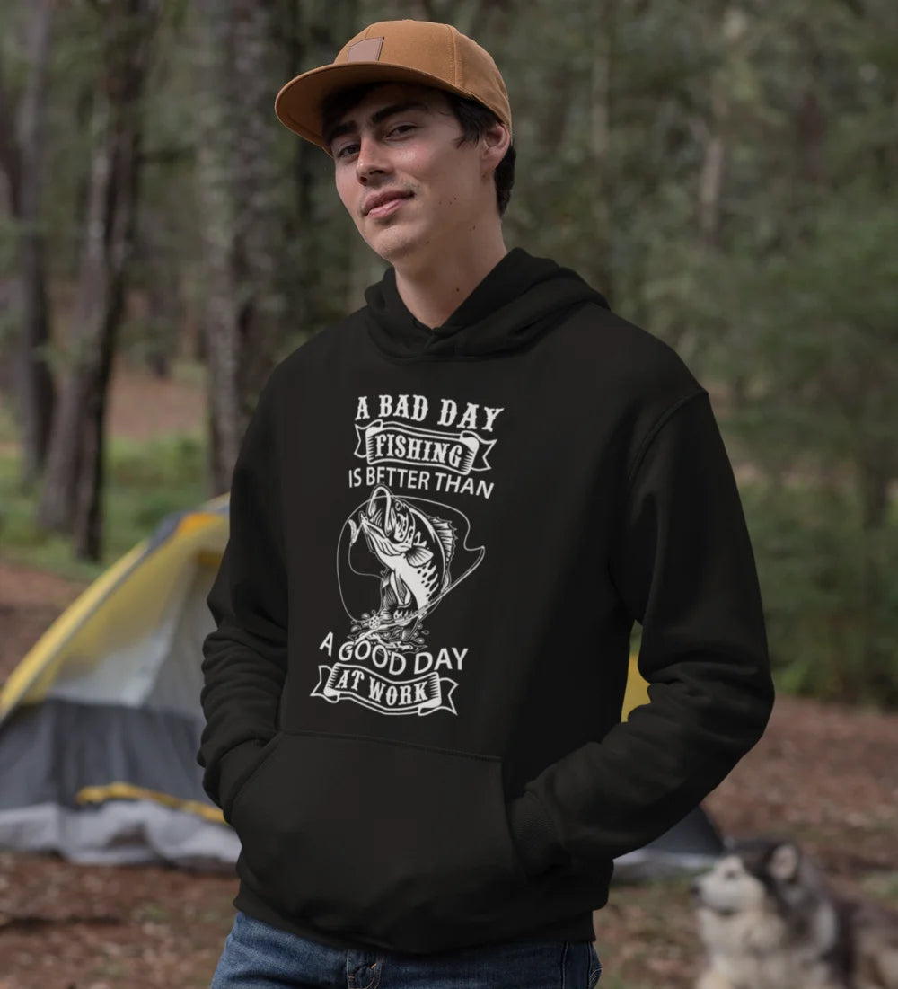 A cozy unisex hoodie featuring the phrase 'A Bad Day Fishing Is Better than a Good Day At Work', perfect for fishing enthusiasts.