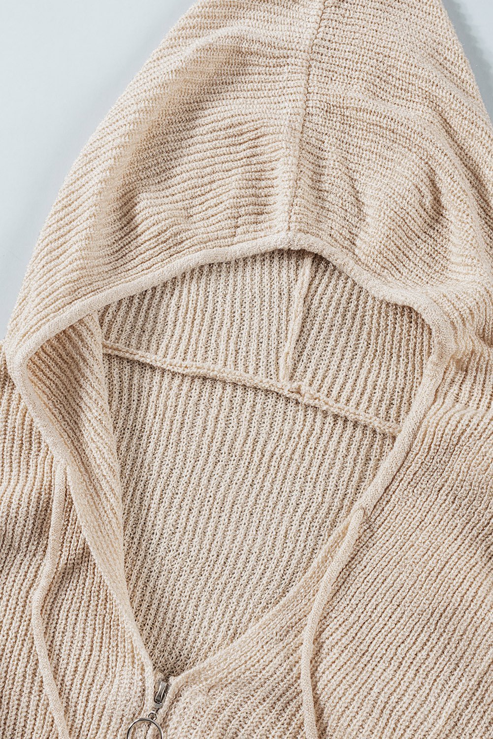 Apricot Zipper Hooded Sweater featuring a v-neck, dropped sleeves, and frayed hemline, perfect for casual winter wear.