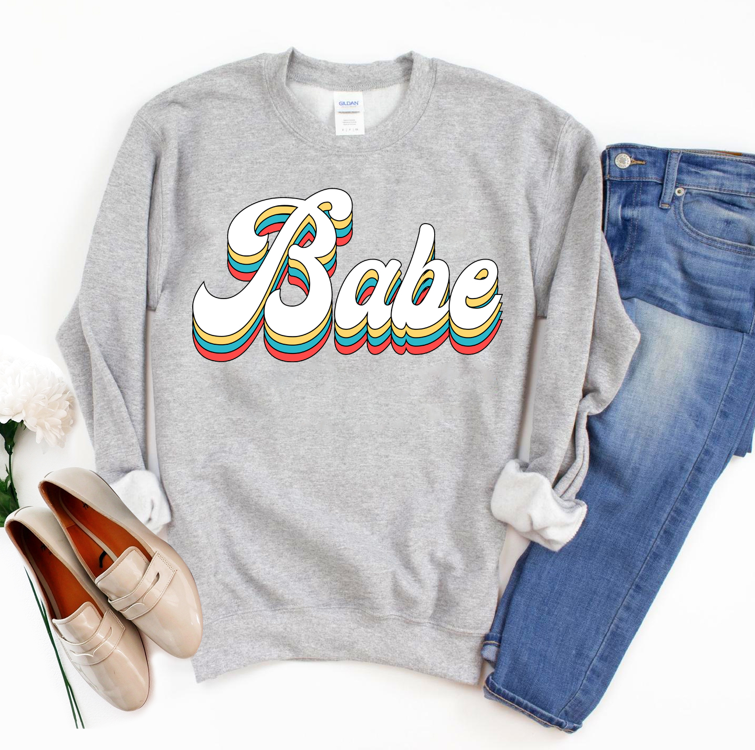 Babe Sweatshirt in a cozy unisex design, featuring a crew neck and soft fabric.