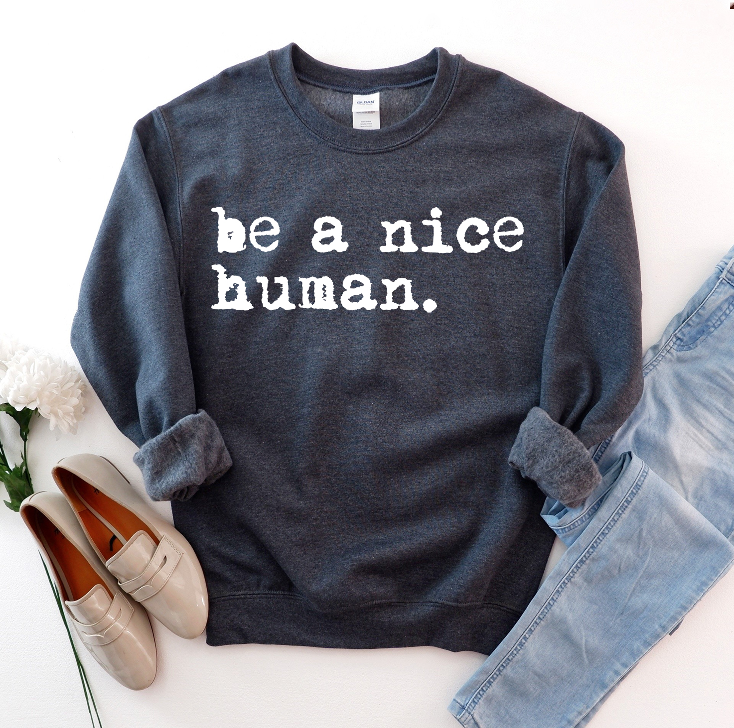 Be A Nice Human Sweatshirt in a soft fabric blend, featuring a crew neck and rib-knit collar, perfect for casual wear.