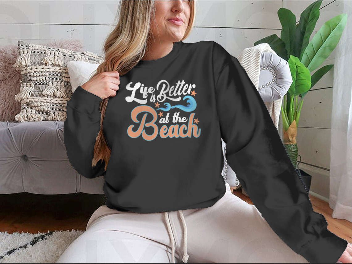 A comfortable cotton T-shirt featuring the slogan 'Life Is Better At The Beach', perfect for beach lovers.