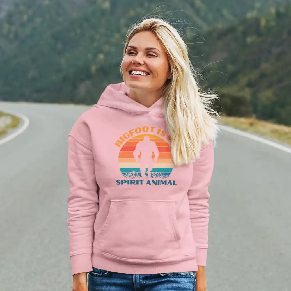 A cozy unisex hoodie featuring the phrase 'Bigfoot Is My Spirit Animal' in bold lettering, perfect for casual wear.