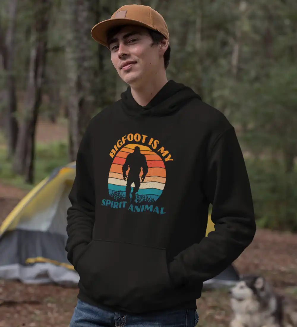 A cozy unisex hoodie featuring the phrase 'Bigfoot Is My Spirit Animal' in bold lettering, perfect for casual wear.