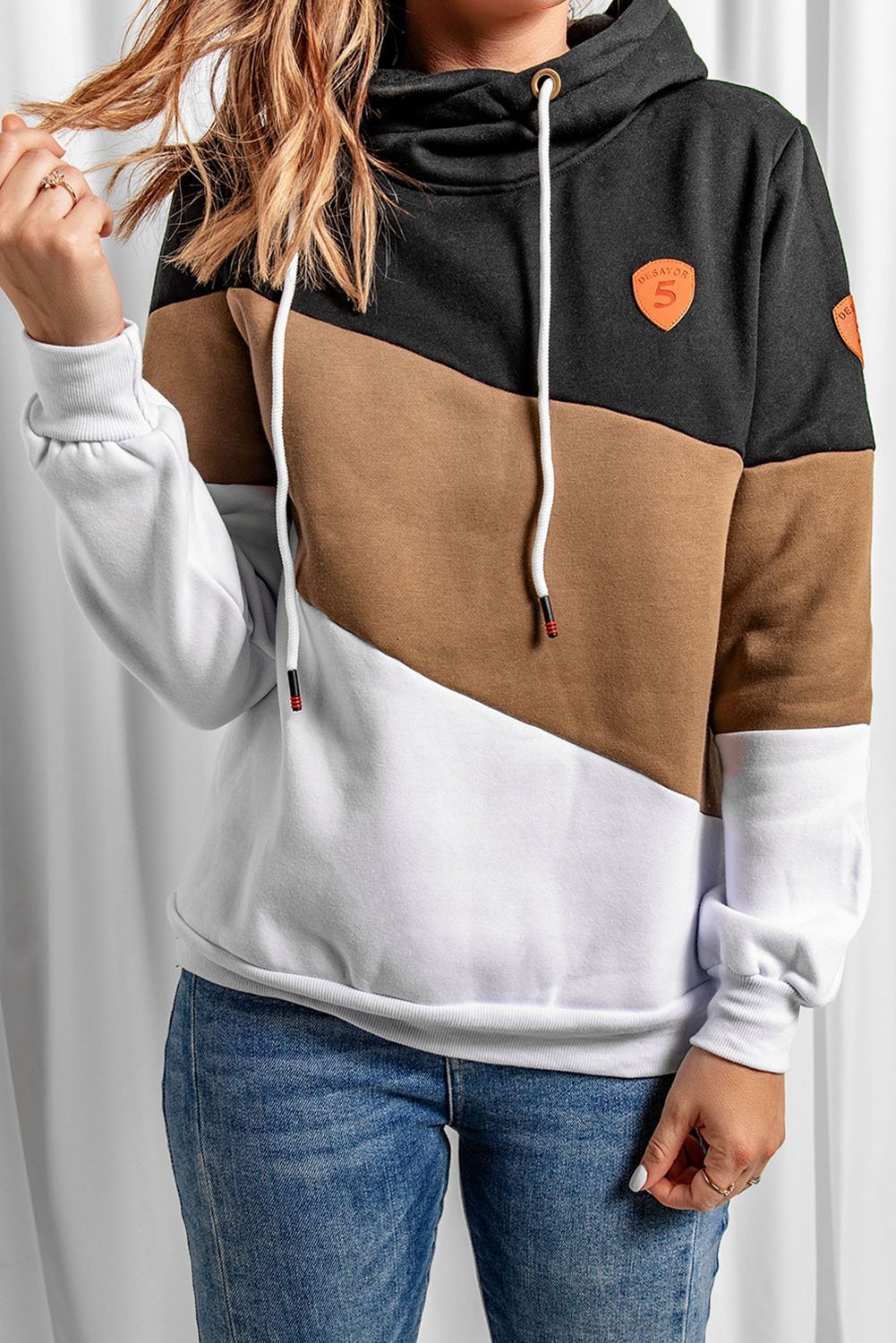 A stylish black colorblock hoodie featuring a hood, full sleeves, and a trendy design, perfect for casual and sporty occasions.