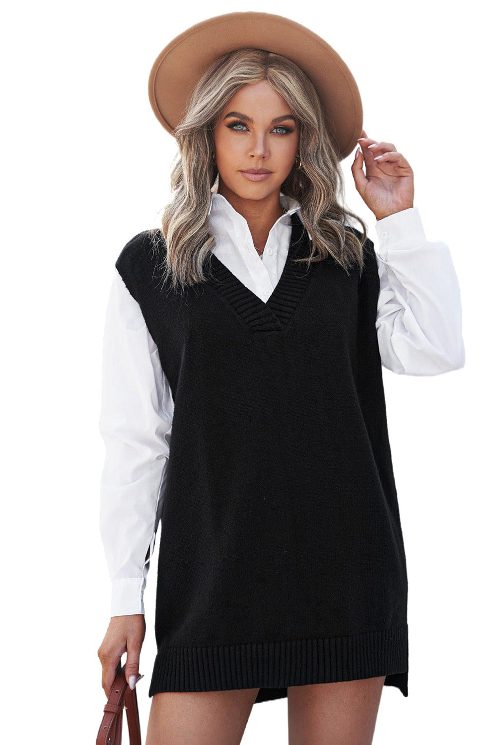 A stylish black knit pullover vest sweater featuring a v-neckline and high-low hemline, perfect for casual layering.