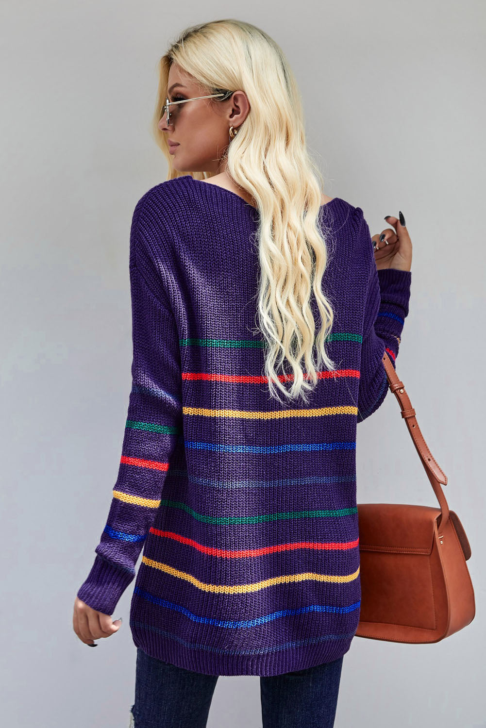 A cozy blue striped loose knit sweater displayed on a mannequin, showcasing its casual style and full sleeves.