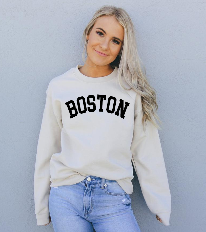 A cozy Boston Sweatshirt featuring a crew neck, made from soft air-jet spun yarn, perfect for casual wear.