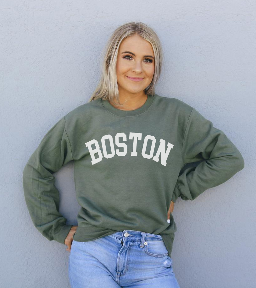 A cozy Boston Sweatshirt featuring a crew neck, made from soft air-jet spun yarn, perfect for casual wear.