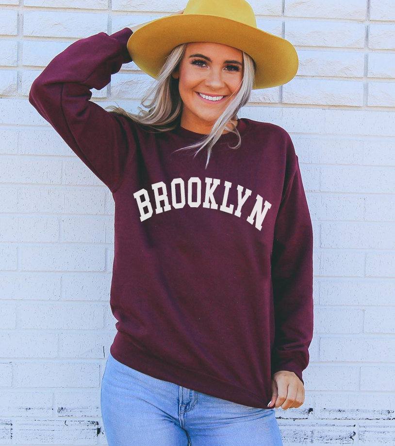 Brooklyn Sweatshirt in a cozy unisex design featuring a crew neck and soft fabric.