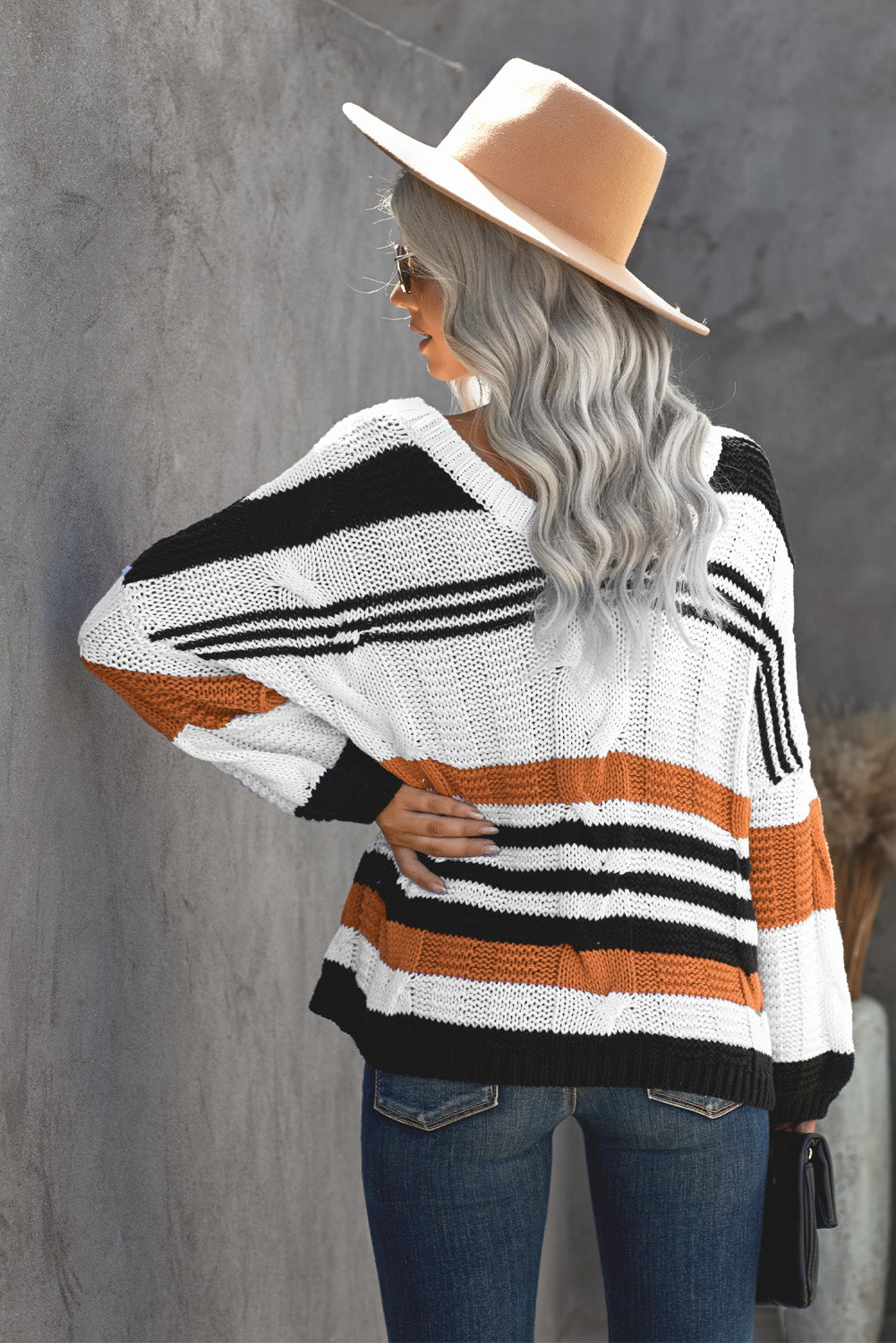 Brown and white striped color block bubblegum v-neck braided knit sweater with puffy sleeves, perfect for winter fashion.