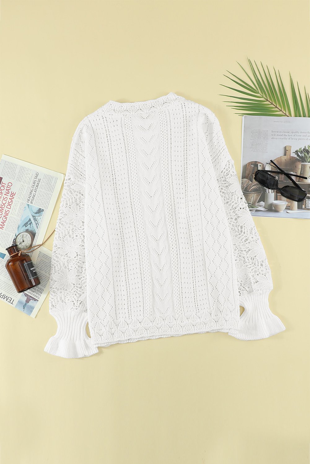 Chic White Crochet Lace Pointelle Knit Sweater featuring scalloped neckline and lace sleeves, perfect for winter fashion.